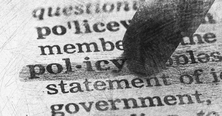 The word Policy being highlighted in a textbook